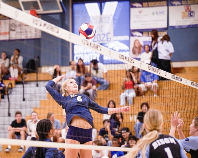 Vista Murrieta High School’s #6, Kylie Berg, spikes a return over the net after being set by a teammate