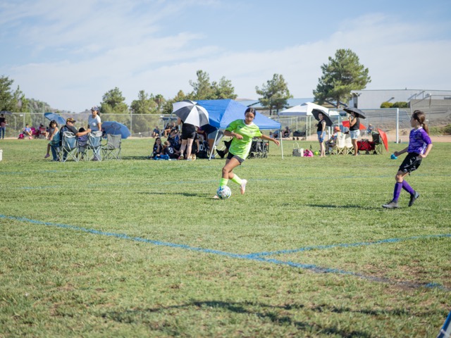 AYSO is back in full swing in Southern California. Giselle Gonzalez drives the ball on the attack. MIDDLE: The Toxic Fury score a goal on their way to defeating the Purple Panthers 4-0 in the 12UG Murrieta Region 1463 opener. RIGHT: The parent tunnel is a beloved tradition for the players.