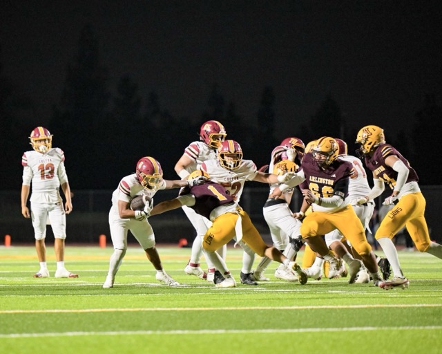 Colton RB Isaiah Garcia #8, breaks a tackle to keep the ball moving on a run outside the tackles