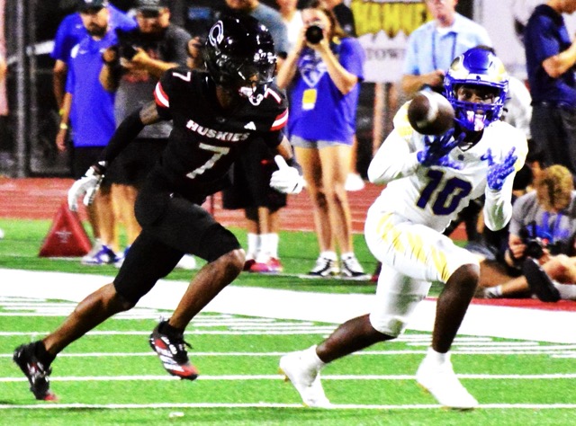 Corona Centennial defender Augus Sanders (7) watches Rancho Santa Margarita receiver Kiyan Callis (10) eye the catch during the Eagles’ win.
