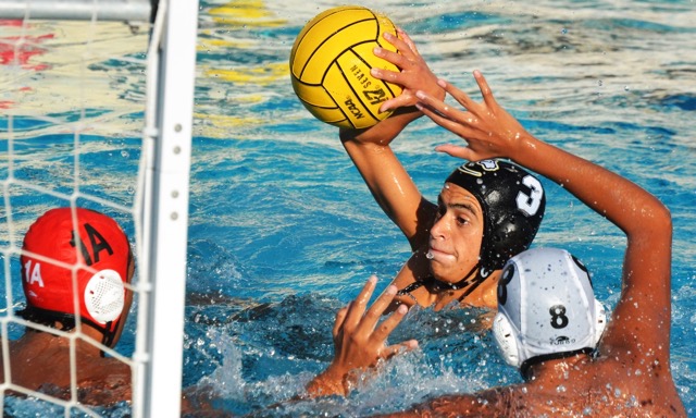 Corona’s Michael Burke (3) fires in a goal past Schurr goalie Aiden Luna (1A) and Cuauhtli Dominguez (8) during the Panthers’ 14 – 4 victory over the Spartans.