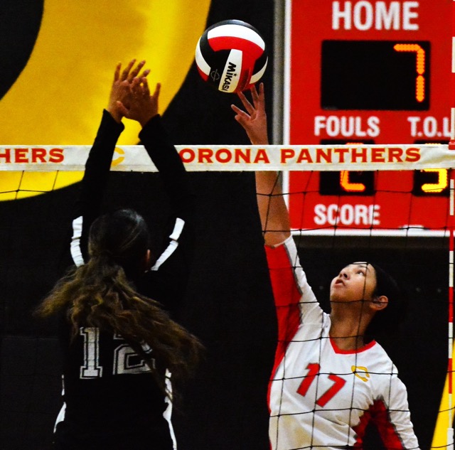 Corona’s Zoey Smith (17) dinks the ball over Lakeside’s Katherine Mendez (12).