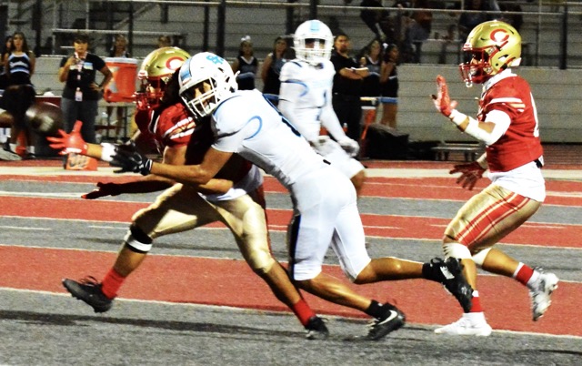Corona linebacker Boaz Castillo (left) cut in front of San Gorgonio receiver Benjamin Maranjo (8) for an interception and rumbled 30 yards for a pick-six touchdown. Corona’s Josiah Sapien (right) made a key block on the return. The Panthers dominated the Spartans 49 – 0.