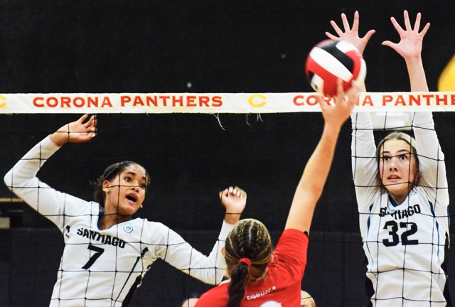 Santiago’s London Kinsey (7) and Devyn Dahlin (32) jump to block a Corona shot during the Sharks 3 – 0 win over the Panthers.
