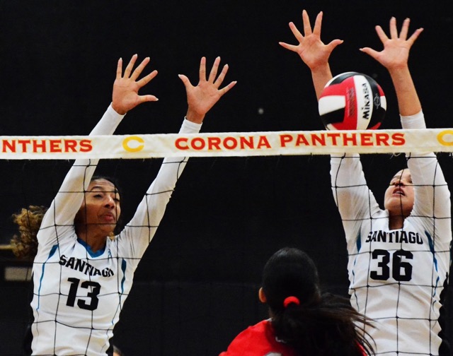 Santiago’s Brooklyn Dye (13) and Maddie Siqueland (36) try to block a Corona shot during the Sharks 3 – 0 win over the Panthers.