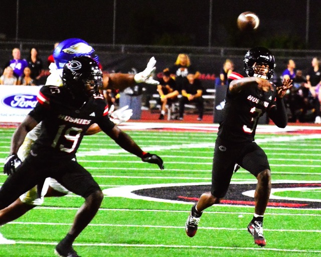 Corona Centennial’s Kennie Leggett (19) looks for an opponent to block while quarterback Jaden Jefferson (3) fires a second-quarter pass against Rancho Santa Margarita. The Eagles nipped the Huskies 21 – 20.
