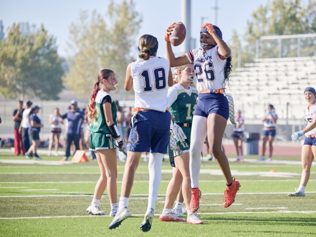 Roosevelt’s Peyton Wade #26 raises the ball while celebrating with teammate Delilah Fernandez #18. Photo by Marcus Walker