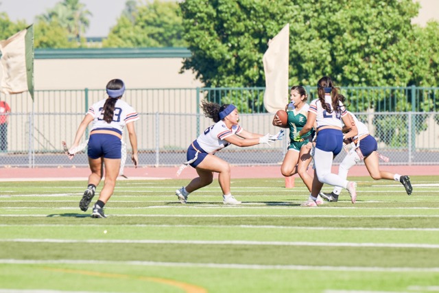 Roosevelt defenders, including Siddalee Plyer #23, left, and Madeline Leyva #25, converge on a Lakeside ball carrier, Christina Barajas #1, during a designed run for minimal yards