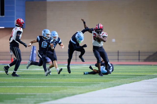 Elsinore’s Lataevious Hernandez #24, breaks through multiple Liberty tackle attempts while tiptoeing the sideline for a moderate gain