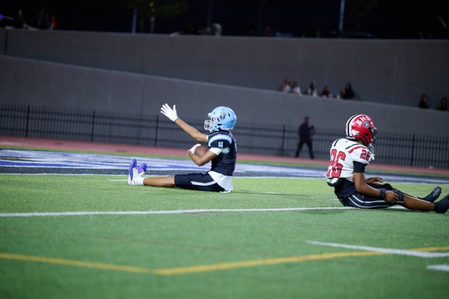 Liberty’s Dominic Hall #4 comes down with the football and signals 1st down after a great catch