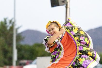 Mia, a dancer with Fiesta Folklorico, lights up the stage in a sweeping, vibrant Sinaloa dress during Mariachi Night at Maren O’Brien Park in Wildomar on Saturday, September 19, 2026. Photo by Lisa Zambrano