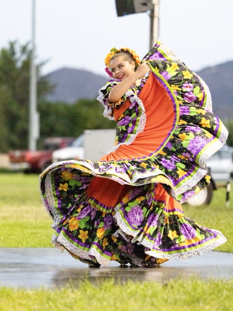 Mia, a dancer with Fiesta Folklorico, lights up the stage in a sweeping, vibrant Sinaloa dress during Mariachi Night at Maren O’Brien Park in Wildomar on Saturday, September 19, 2026. Photo by Lisa Zambrano
