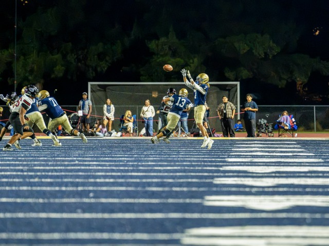 Vista Murrieta’s wide receiver, Shane Granger #7, reaches for a pass on the outside while Centennial defenders close in. The Centennial Huskies defeated the Vista Murrieta Bronco's 65-14 in the league opener.