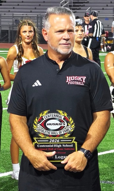 Centennial football coach Matt Logan was honored before last Friday’s homecoming game as one of the 10 inaugural inductees of the school’s recently formed Athletics Hall of Fame. Fellow inductees are: former NFL players Lonie Paxton and Vontaze Burfict, football player JJ Taylor, wrestling coach Randy Campbell, basketball players Jayda Curry, Jared McCain, and Jamaal Williams, baseball player Mike Stodolka, and Track and Field standout Rylee Penn.