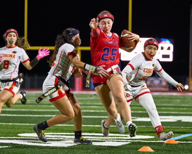 Great Oak’s  Keira Smith (25) scrambles out of the pocket to gain 15 yards for the Wolfpack.