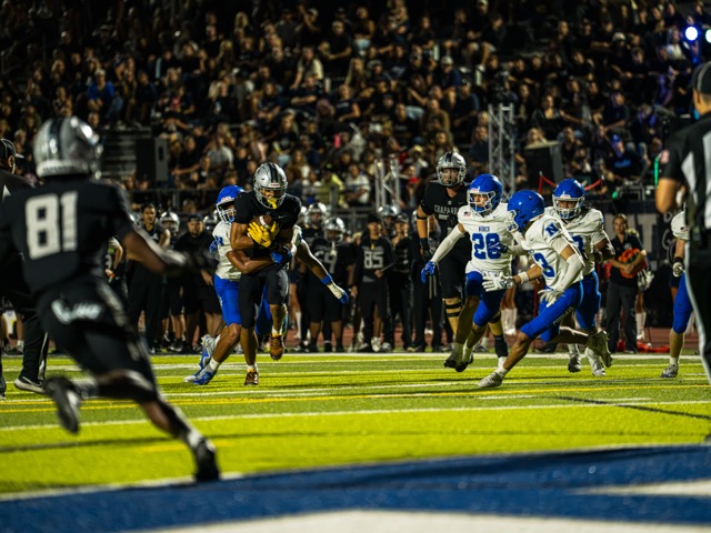 Chaparral’s Tycen Johnson (7), makes a catch and drags a defender upfield in the red zone against Norco. The Chapparal Pumas pounced the Norco Cougars 42-16, Friday, October 9th.