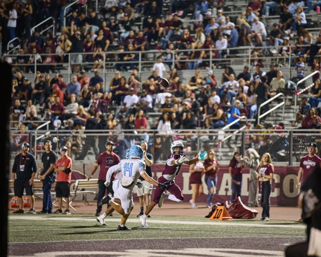 Paloma Valley’s, Askari Richard #11, reaches for an overthrown pass while Liberty’s Reid Kiser (#14) closes in. The pass fell incomplete.