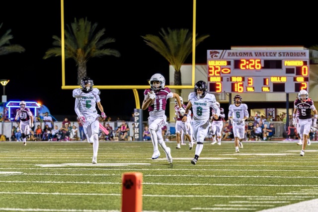 Paloma Valley’s Askari Richardson (#11) breaks into the open field and races for a touchdown. The Paloma Valley Wildcats ran away with the game defeating the Perris Panthers, 46-0.