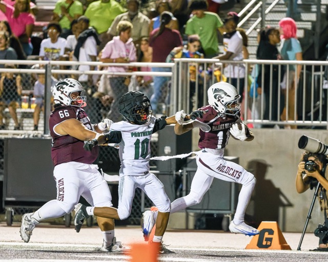 Paloma Valley Askari Richard (#11) fights through contact from Perris’s Kaizer Daniels (#10) near the goal line and scores a touchdown