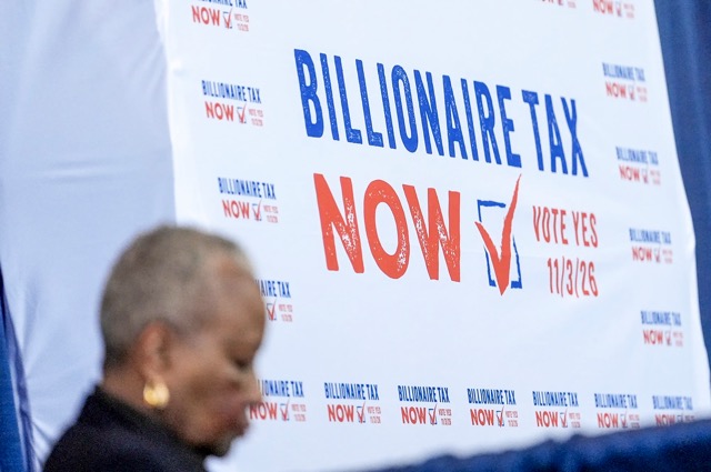 A sign displayed at the Billionaire Tax Now booth at the 2026 California Democratic Party State Convention in San Francisco on Feb. 21, 2026.  Credit: Photo by Jeff Chiu, AP Photo