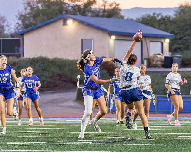 Temescal Canyon’s Reagan Pickens (#5) disrupts a pass intended for Jurupa Valley’s #8. 