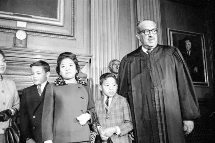 October 2. Supreme Court Associate Justice Thurgood Marshall, right, stands with his family as they watch him take his seat at the court for the first time, Oct. 2, 1967. From left are Marshall's son Thurgood, Jr., 11, wife Cecilia Suyat, and son John, 9. Marshall joined the Supreme Court in 1967 as the court's first Black justice.  Credit: AP Photo/Henry Griffin