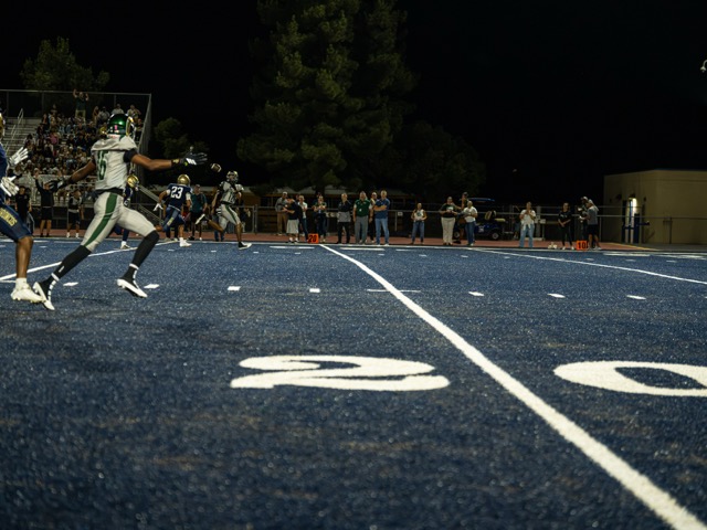 Murrieta Mesa’s #12, Keegan Williams hauls in a deep ball and races downfield for a long touchdown against city rival Vista Murrieta.